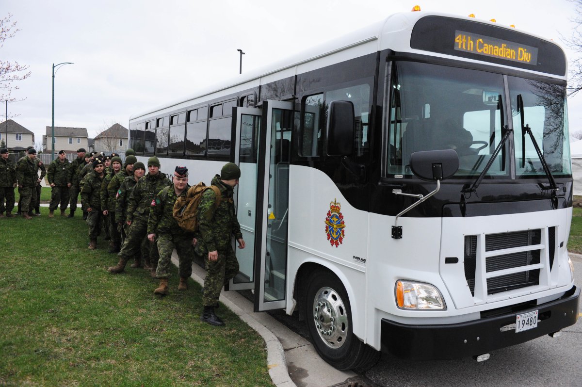 Army reservists in London board a bus headed for the Ottawa region on April 27.