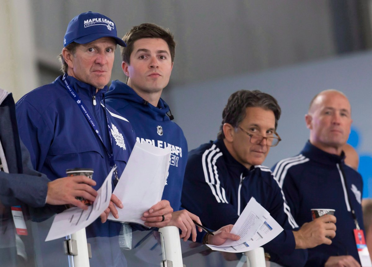 Toronto Maple Leafs head coach Mike Babcock, left, general manager Kyle Dubas, second from left, and president Brendan Shanahan, second from right.
