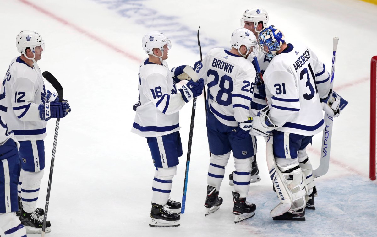 Toronto Maple Leafs goaltender Frederik Andersen (31) is congratulated by teammates after Toronto's 4-1 win against the Boston Bruins in Game 1 of an NHL hockey first-round playoff series Thursday, April 11, 2019, in Boston.