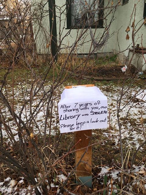 A sign sits on the post where a Little Free Library was stolen from Pamela McLean’s front lawn in Renfrew.