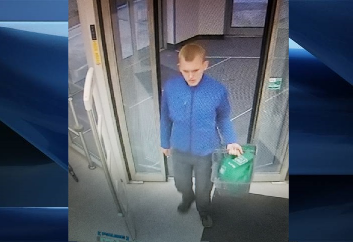 Surveillance footage showing Lucas Alexander Teams, 23, at the Rexall Pharmacy at Beaverbrook Avenue and Wonderland Road.