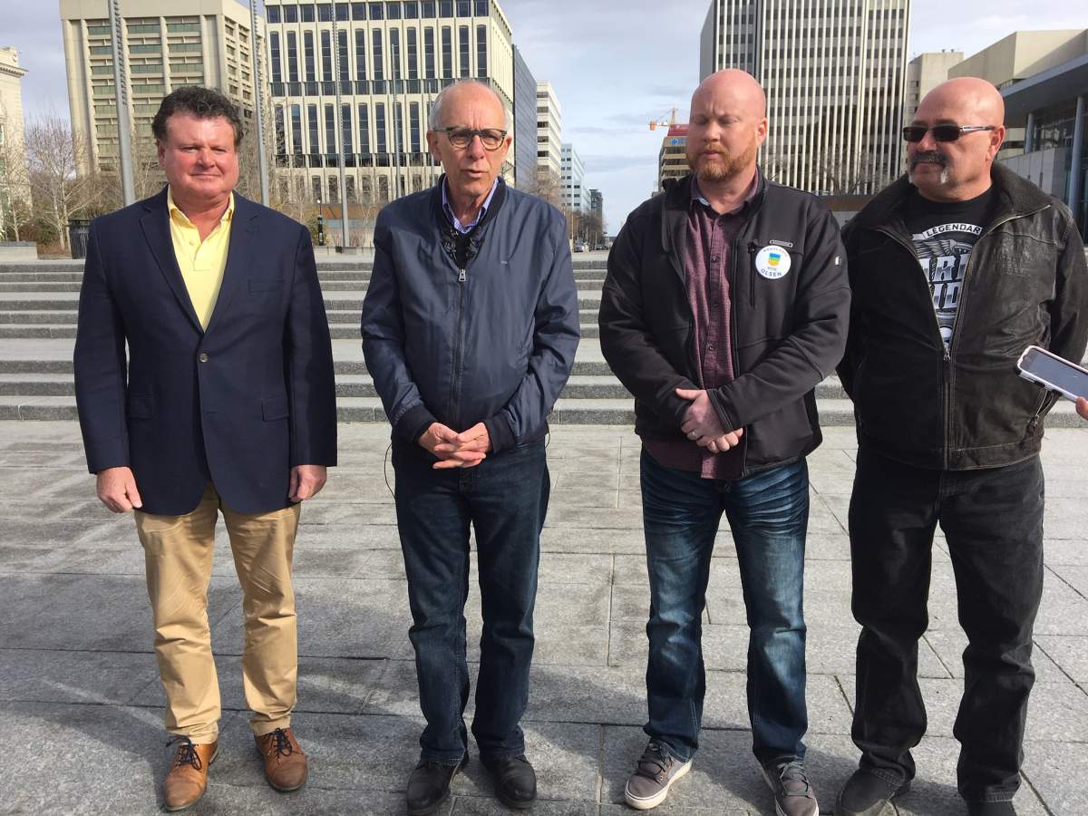 Stephen Mandel, second from the left, speaks about allegations of robocalls in the Alberta election on Sunday, April 14, 2019.