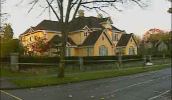 Police tape outside the Shaughnessy home where Raymond Huang was gunned down in 2007.