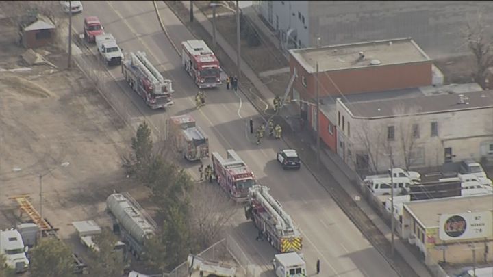 A spokesperson for Edmonton Fire Rescue Services said six crews were dispatched to a fire at a building in the area of 66 Street and 124 Avenue at about 4:46 p.m. and they arrived at the scene four minutes later.