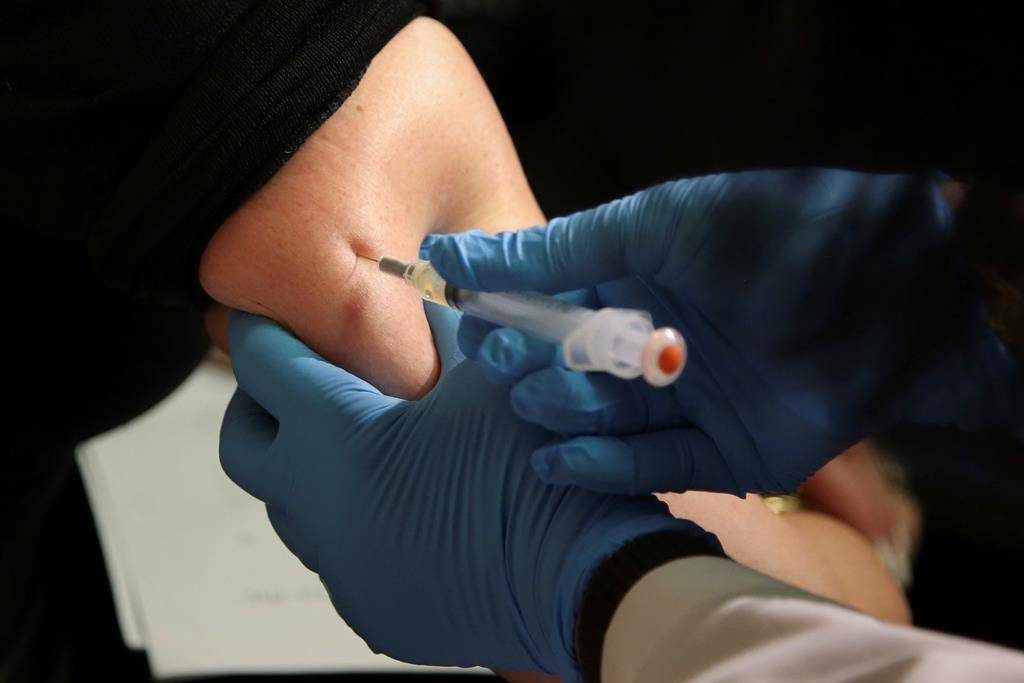 In this March 27, 2019, file photo, a woman receives a measles, mumps and rubella vaccine at the Rockland County Health Department in Pomona, N.Y.