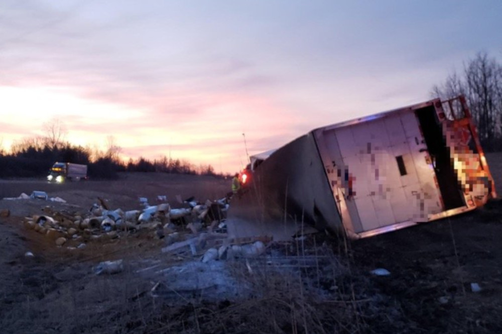 OPP are investigating the cause of a tractor-trailer rollover on Hwy. 402 that spilled about 6,000 pounds of paint near the roadway.