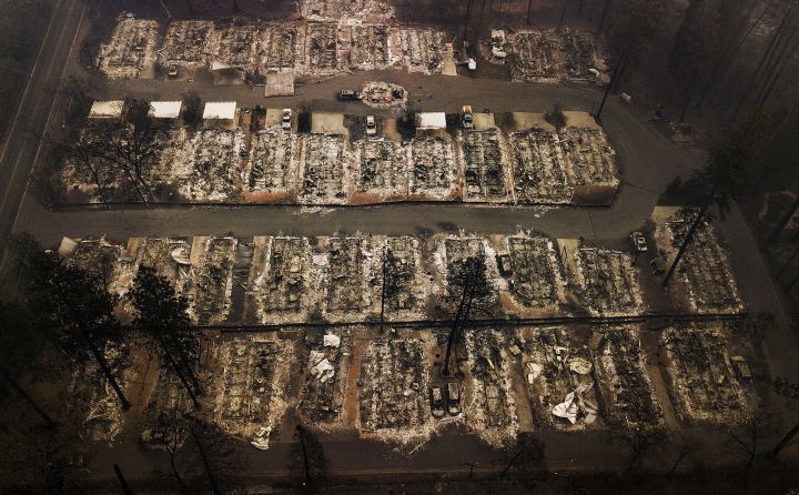 This Nov. 15, 2018, aerial file photo shows the remains of residences leveled by the Camp wildfire in Paradise, Calif. A Canadian company has been selected to help rebuild Paradise, the California community that that was almost entirely destroyed by a wildfire last year. 
