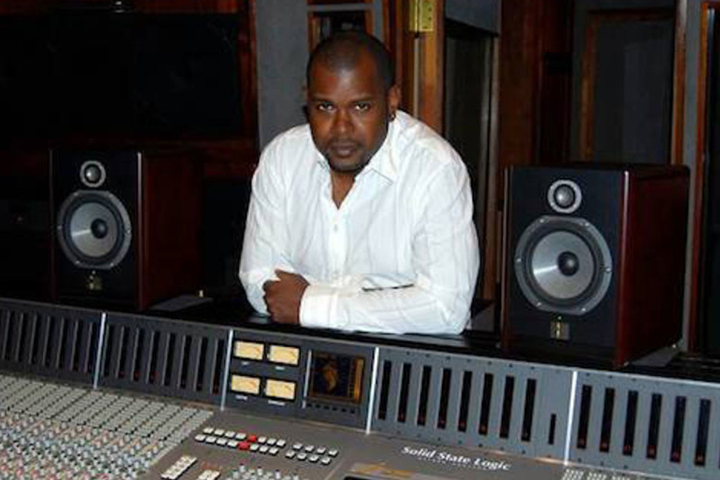 Producer George Ian Boxill working in a studio.