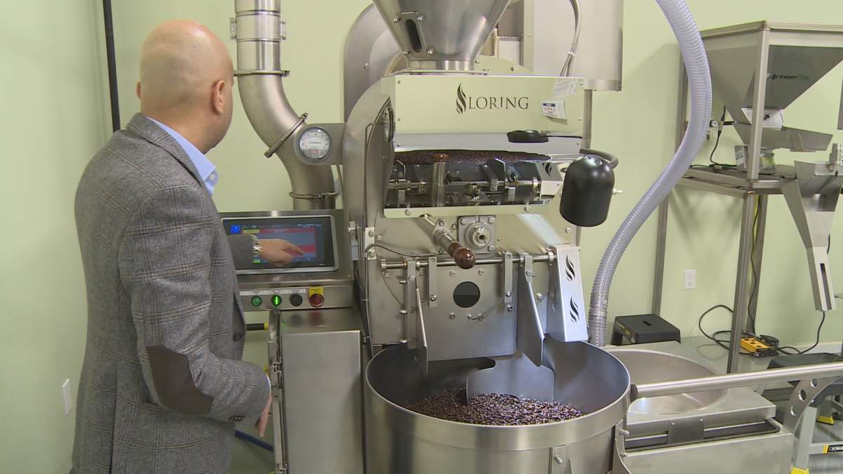 Mohamed Khirallah demos his roasting machine
