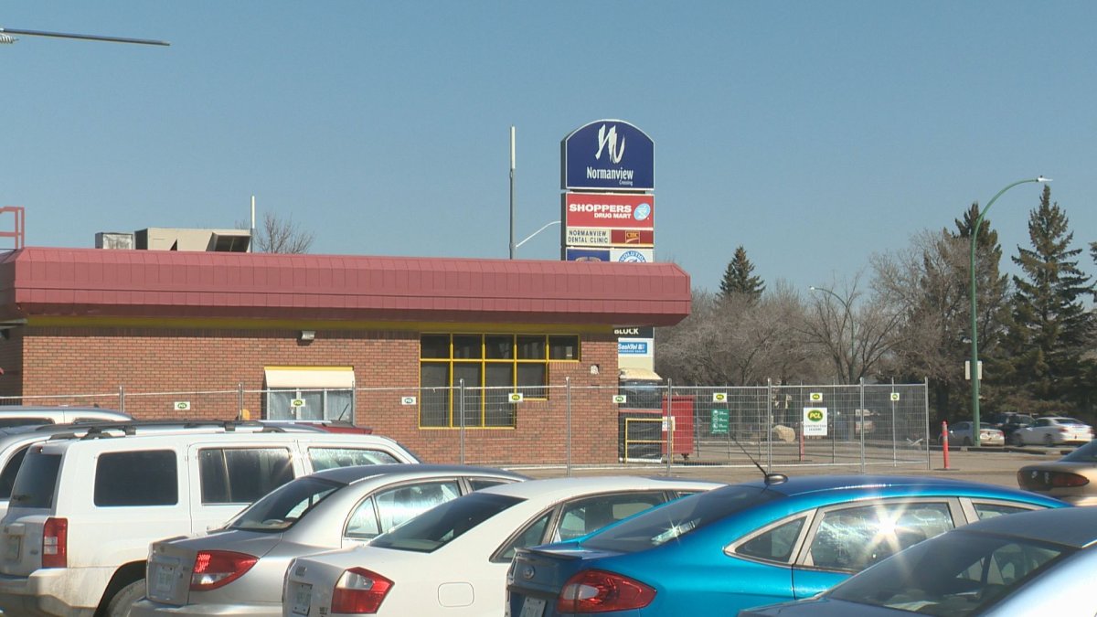 Regina police are looking for a male suspect who allegedly tried to rob a woman at gunpoint in the Normanview Mall parking lot Wednesday .