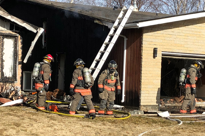 A Saskatoon fire investigator said hot ashes from a fire pit were improperly disposed into a garbage dumpster, causing $500,000 damage to two homes.