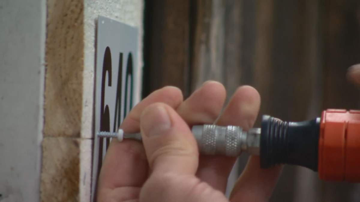 A laneway address sign is installed behind a home in Vancouver's Strathcona neighbourhood Thursday, April 18. Vancouver police are ensuring 400 residents get similar signs installed in order to help first responders.