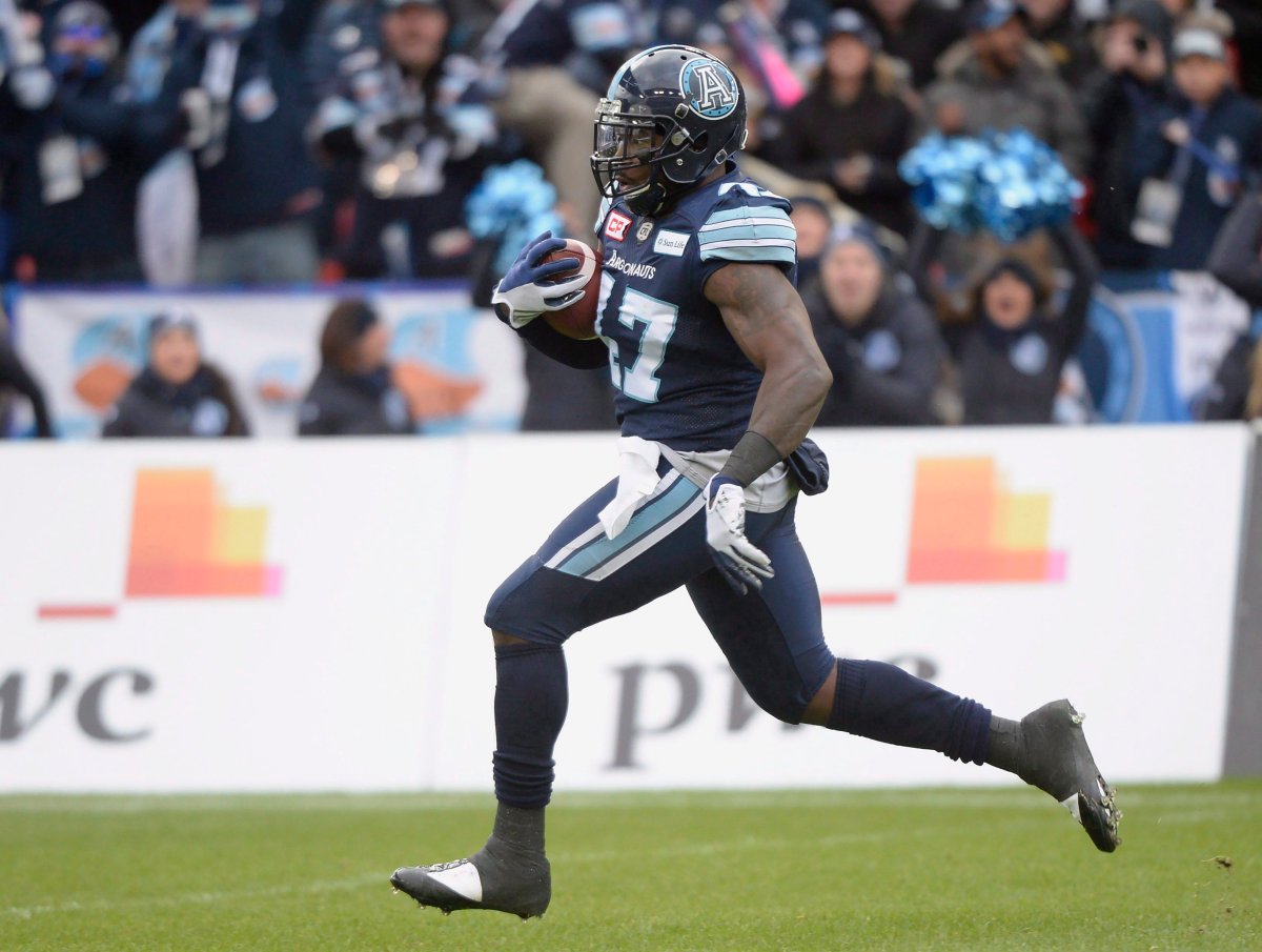 Toronto Argonauts linebacker Terrance Plummer (47) runs the ball back for a touchdown after an interception during first-half CFL East Division final football action against the Saskatchewan Roughriders at BMO Field in Toronto, Sunday, Nov. 19, 2017. 
