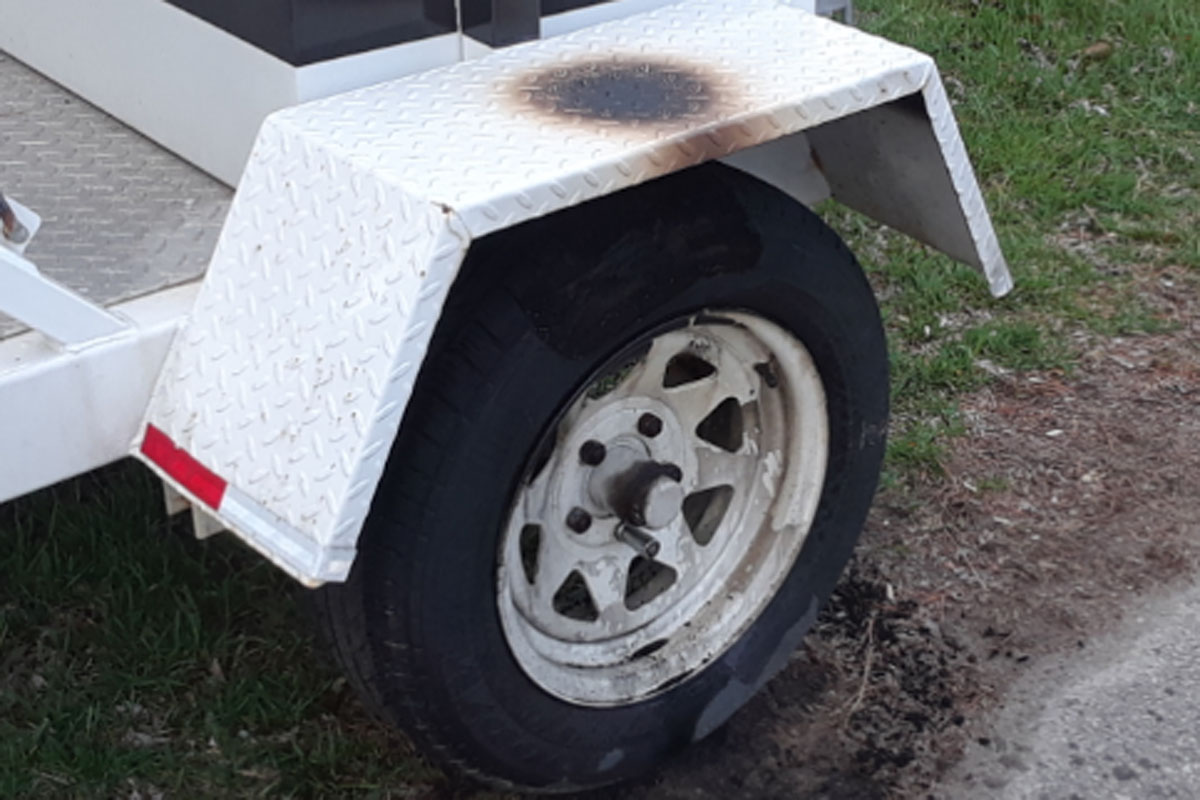 The burned tires of an OPP radar trailer that police say was set on fire on Monday morning.