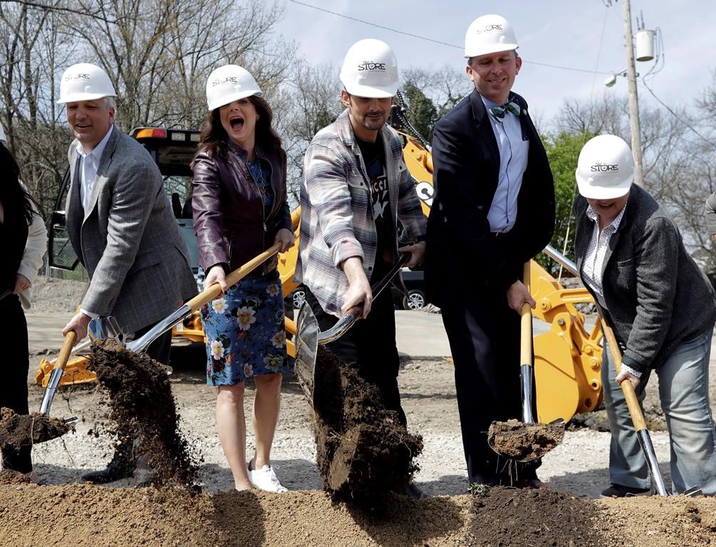 Country music star Brad Paisley, center, and his wife, actress Kimberly Williams-Paisley, second from left, take part in the groundbreaking ceremony for The Store, a free grocery store for people in need, Wednesday, April 3, 2019, in Nashville, Tenn.