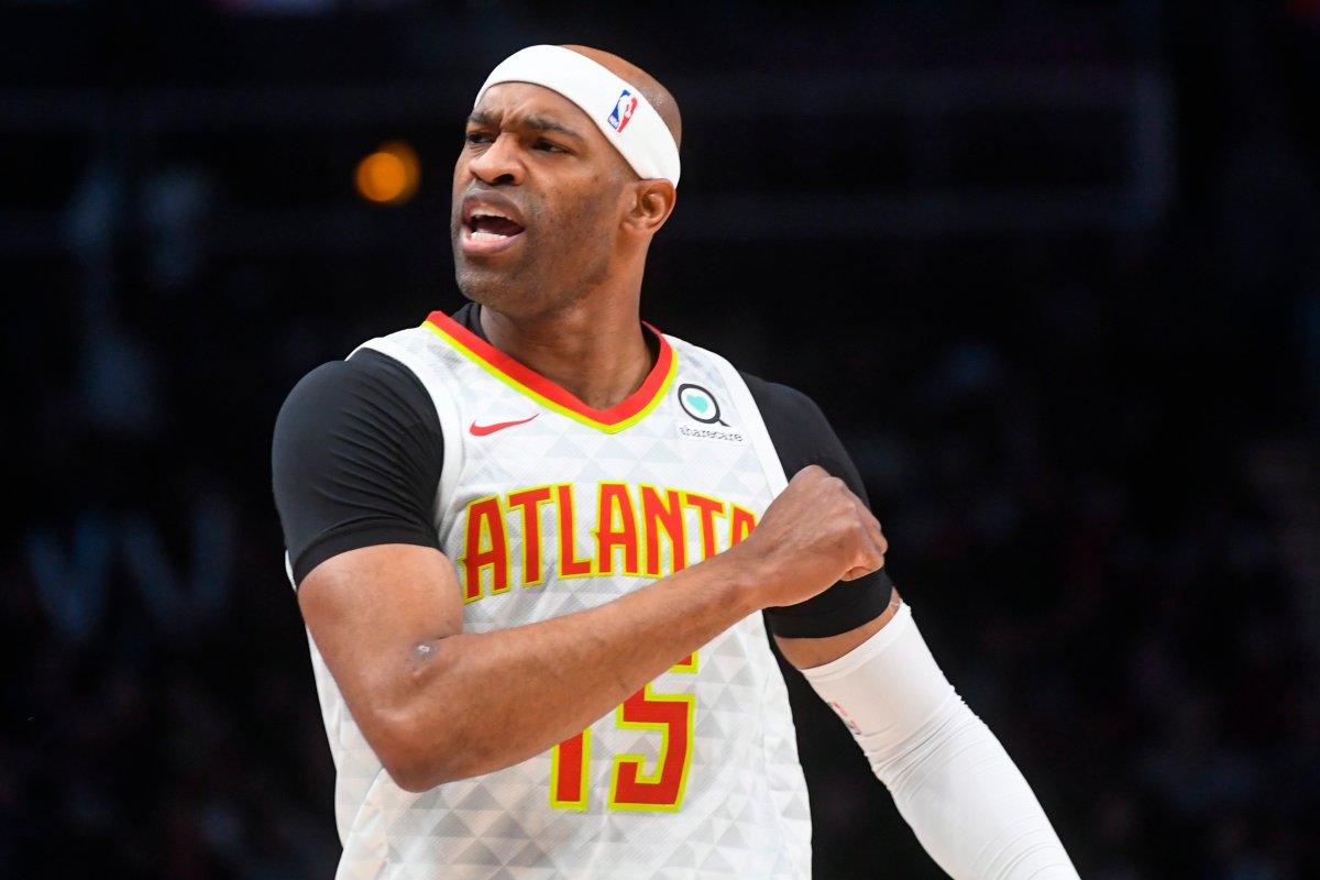 Atlanta Hawks forward Vince Carter reacts after making a three-point basket during the first half of an NBA basketball game against the Utah Jazz, Thursday, March 21, 2019, in Atlanta.