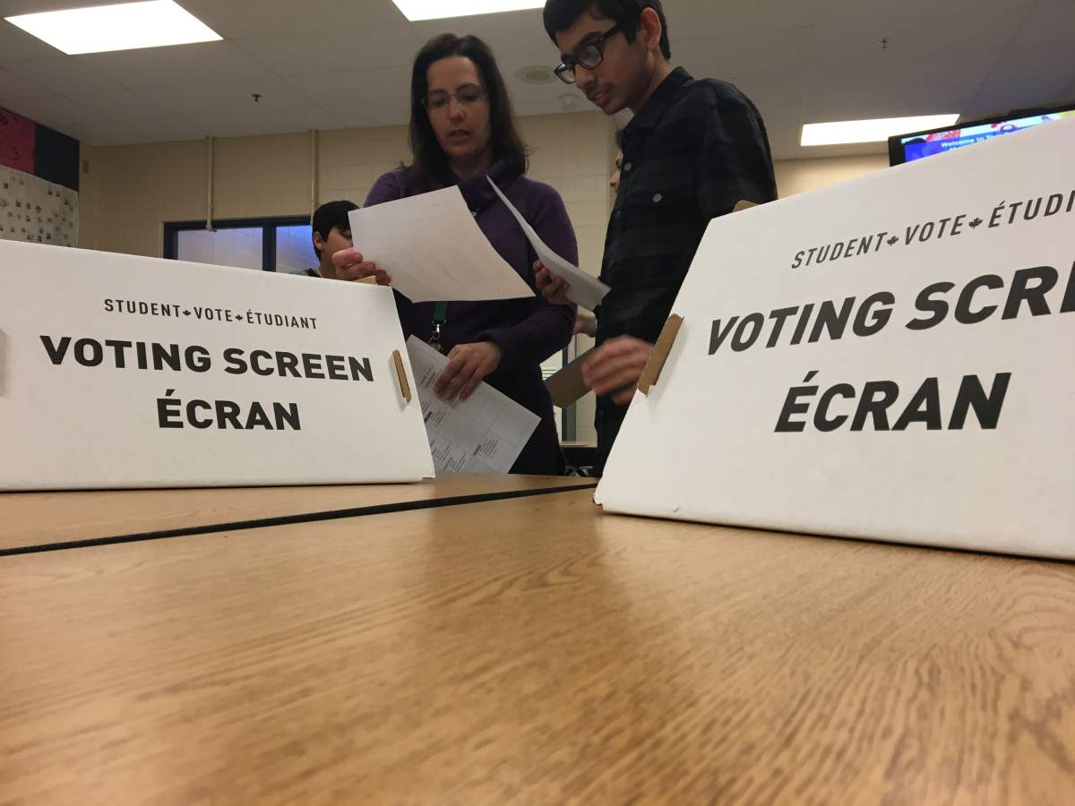 Teacher Lori Hogue works with students.