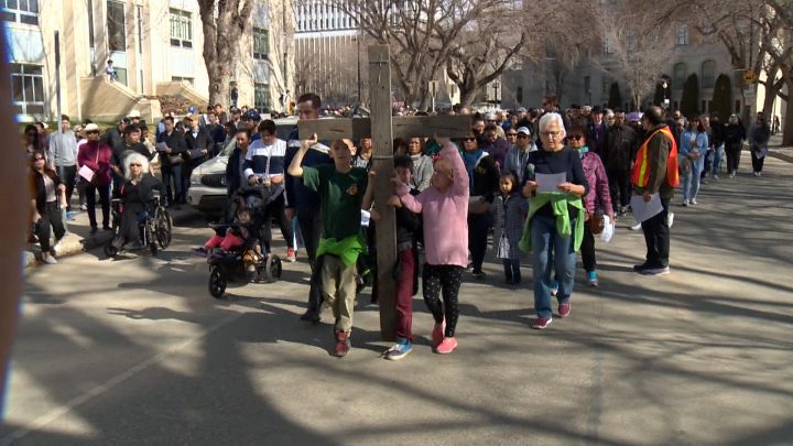 Concerns addressed in prayer at each station at the Way of the Cross in Saskatoon included poverty, injustice, racism and the sick and suffering.