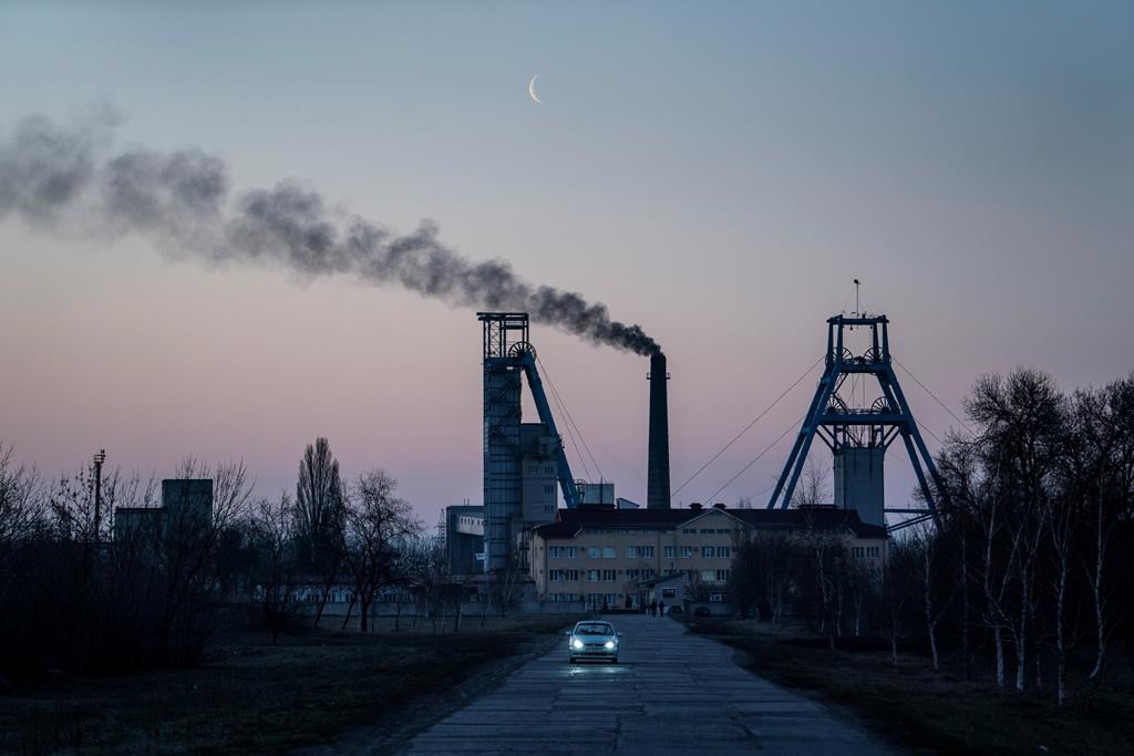 The Stepova coal mine just before dawn in Pershotravensk, Dnipropetrovsk region, eastern Ukraine, Monday, April 1, 2019.