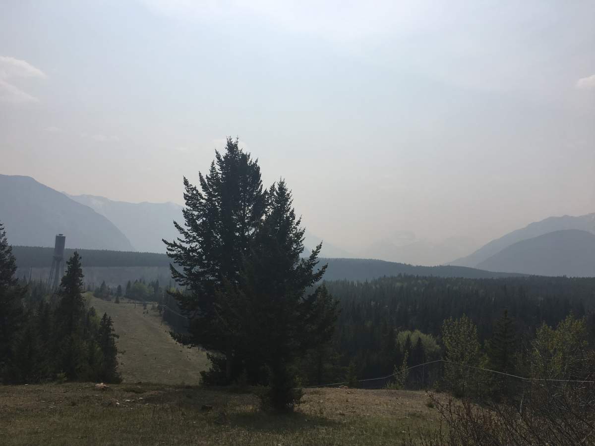 Smoke from the wildfire near High Level creating haze in Banff, Alta., May 28, 2019.