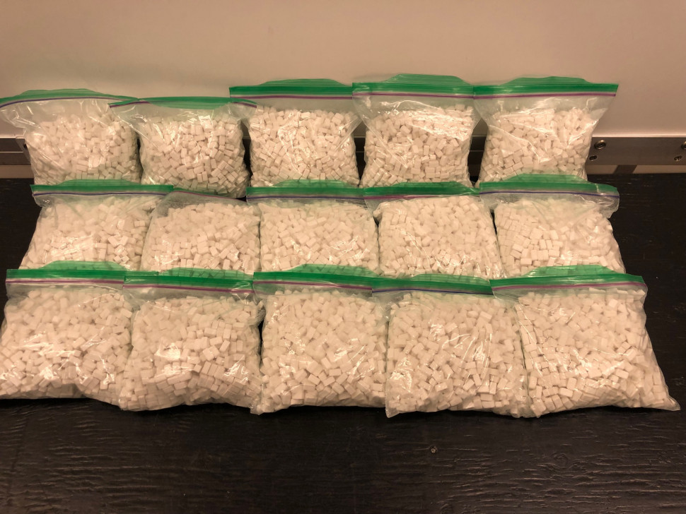 Police seized more than 15,000 tablets of what are believed to be methamphetamine, as well as other unidentified pills.