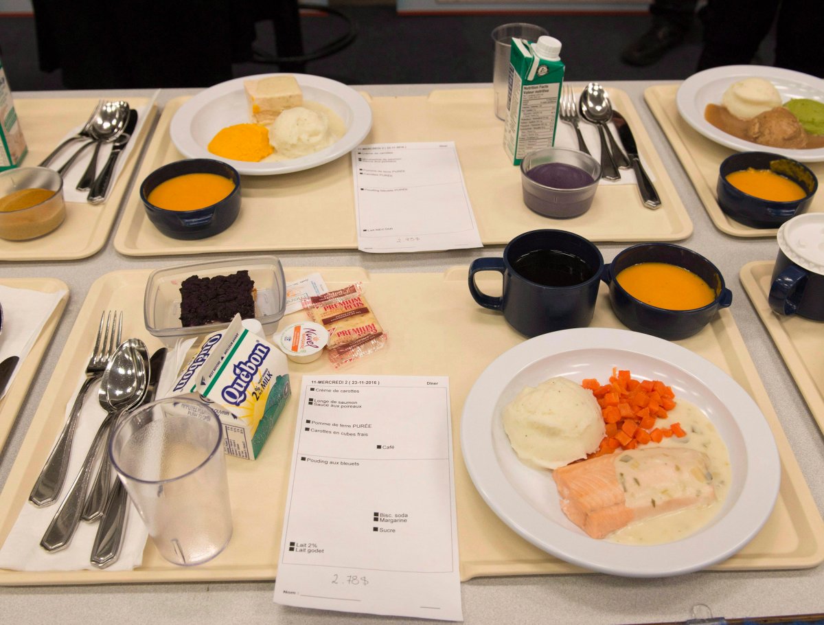 A plate of salmon, foreground, with its puree counterpart as served in long term care facilities for seniors and hospitals, Wednesday, November 23, 2016 in Quebec City. 
