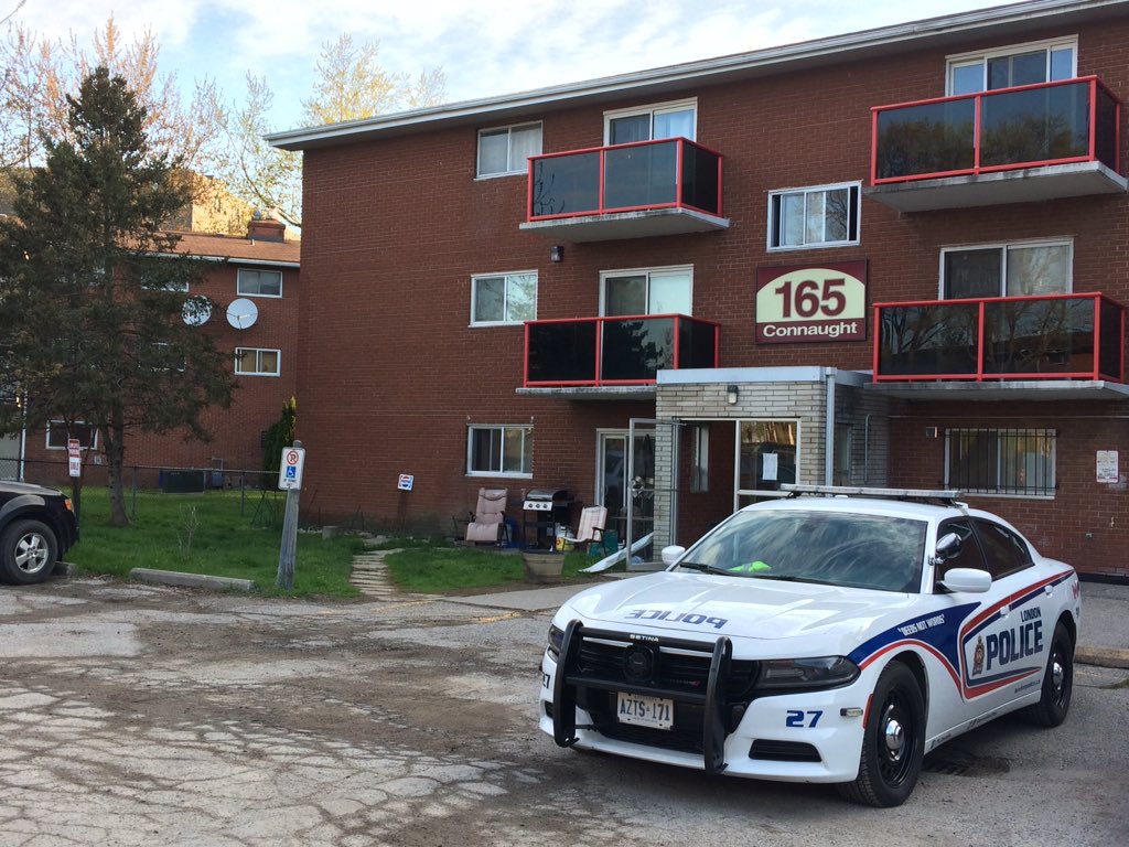 A single police cruiser parked outside 165 Connaught Ave., where a man was killed on Monday afternoon.