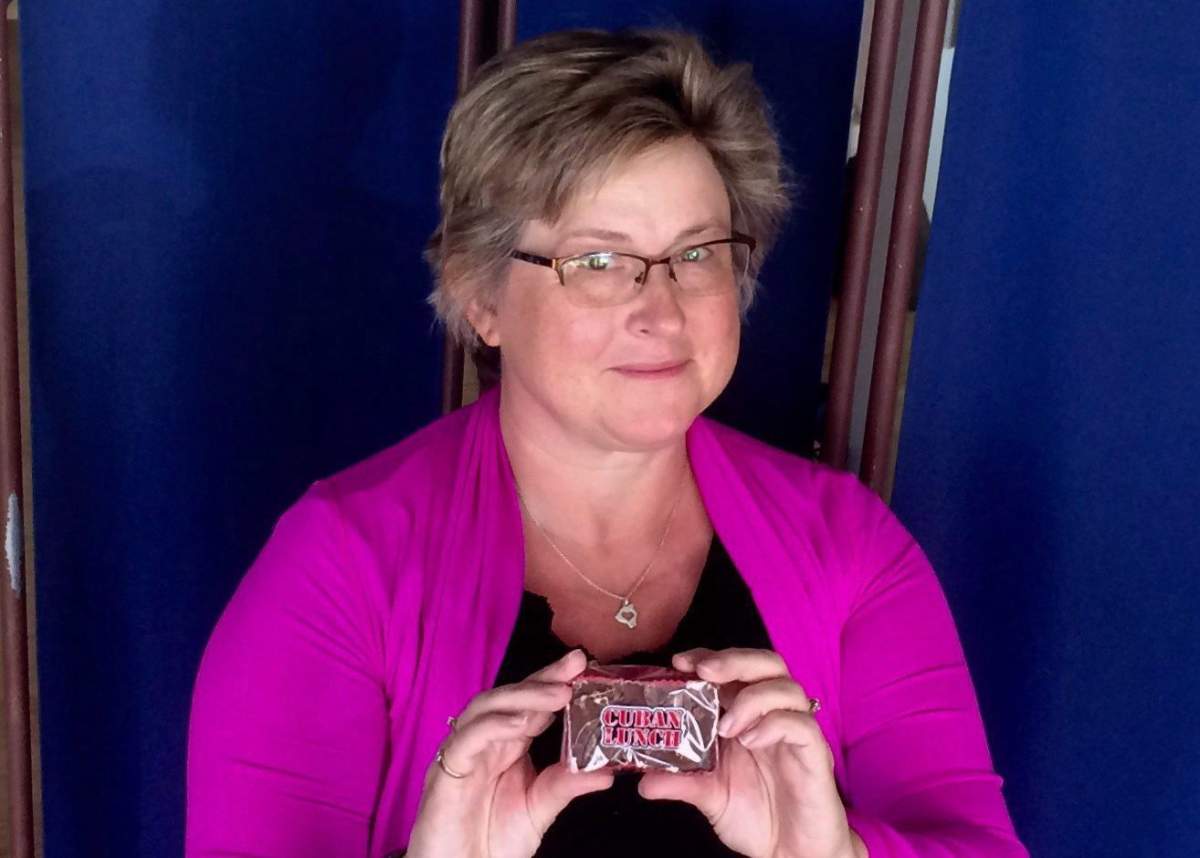 Crystal Regehr Westergard holds a Cuban Lunch, a rectangular peanut-and-chocolate confection, in this undated handout photo.
