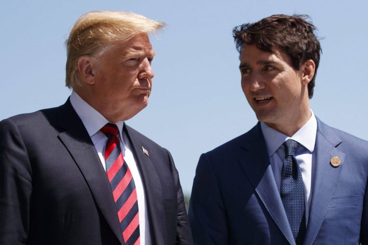 U.S. President Donald Trump talks with Canadian Prime Minister Justin Trudeau during a G7 summit welcome ceremony in Charlevoix, Canada, on June 8, 2018.