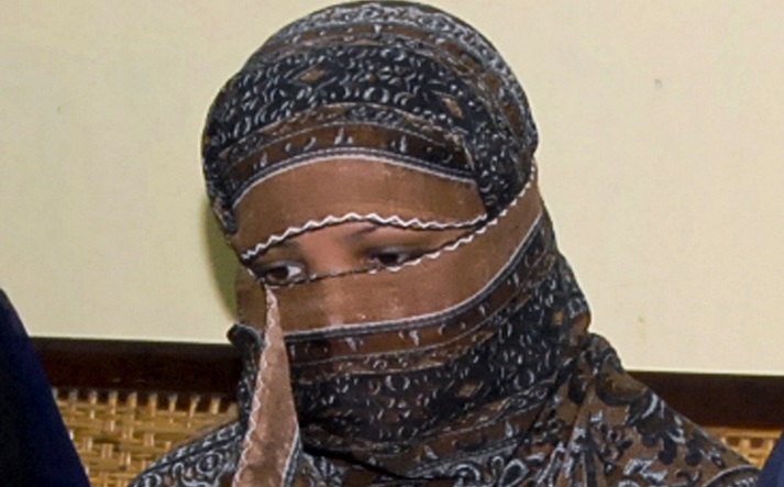 In this Nov. 20, 2010, file photo, Asia Bibi, a Pakistani Christian woman, listens to officials at a prison in Sheikhupura near Lahore, Pakistan.