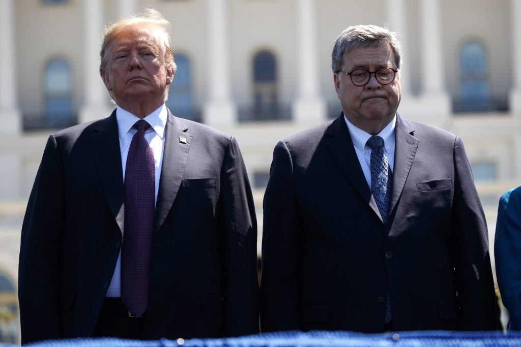 President Donald Trump stands with Attorney General William Barr during the 38th Annual National Peace Officers' Memorial Service at the U.S. Capitol, Wednesday, May 15, 2019, in Washington.