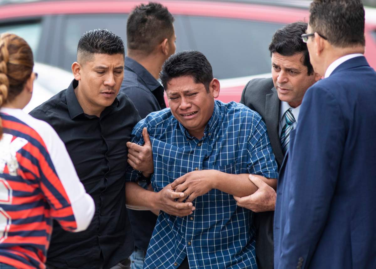 Arnulfo Ochoa, the father of Marlen Ochoa-Lopez, is surrounded by family members and supporters, as he walks into the Cook County medical examiner’s office to identify his daughter’s body, Thursday, May 16, 2019 in Chicago.