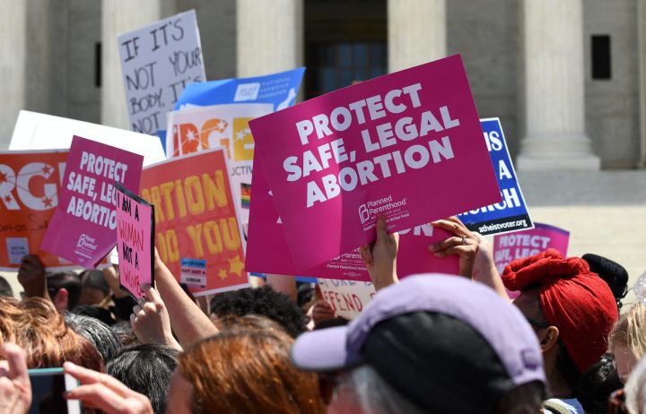 Pro-abortion activists hold placards during a rally at the Supreme Court in reaction to the passage of bills in Alabama, Georgia, Missouri and other states that restrict access to abortion on May 21, 2019 in Washington, D.C.