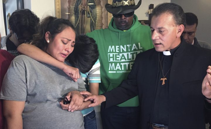 In this Tuesday, May 21, 2019 photo provided by WBEZ Radio is Adilene Marquina, left, as she sobs after announcing she will be seeking sanctuary inside Faith, Life and Hope Mission church on Chicago's Southwest Side. 