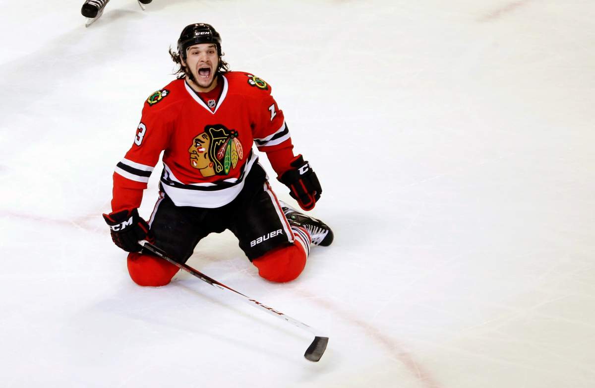 In this March 6, 2013, file photo, Chicago Blackhawks left wing Daniel Carcillo celebrates his winning goal during the third period of an NHL hockey game against the Colorado Avalanche, in Chicago. 