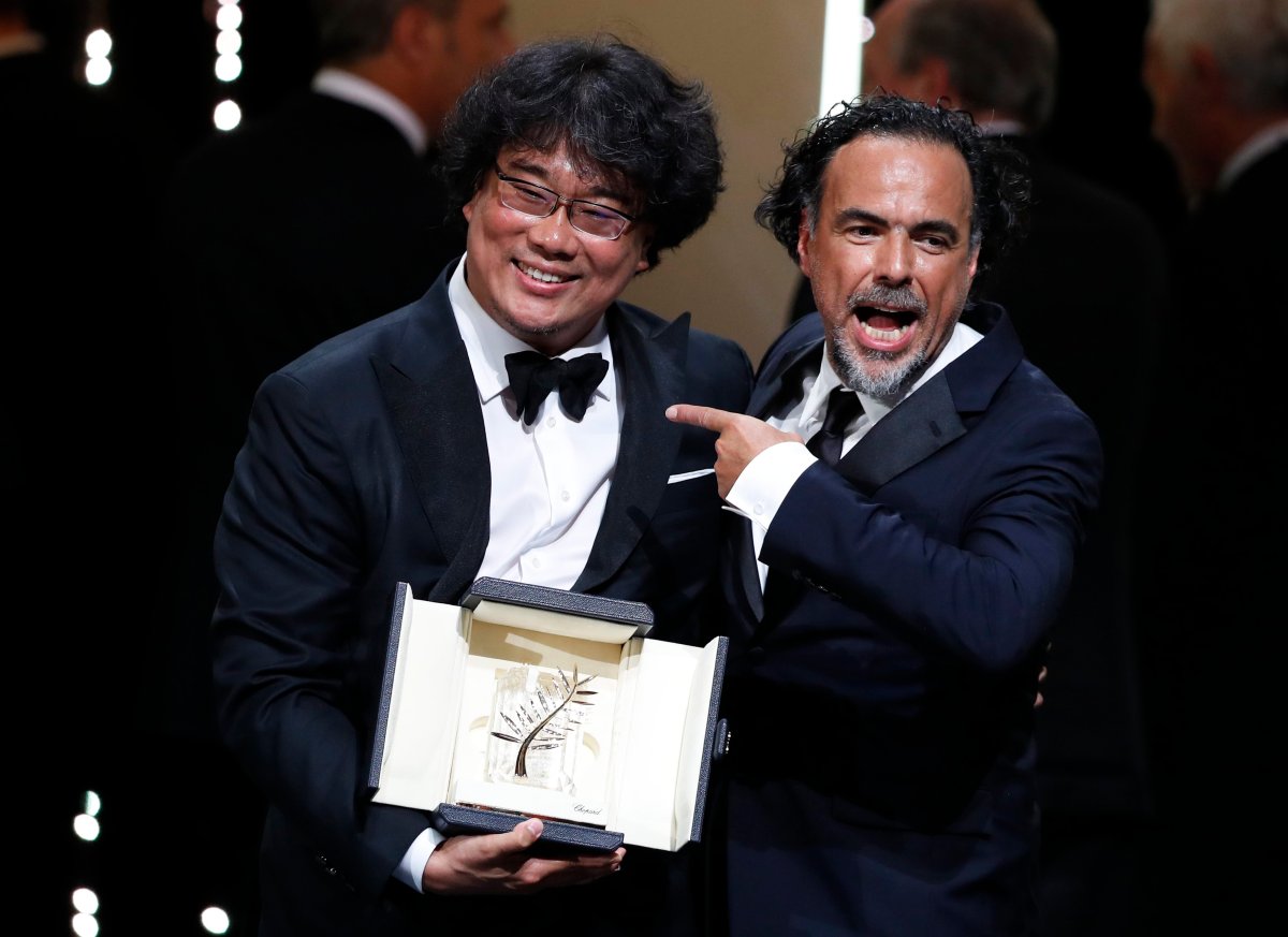South Korean director Bong Joon-ho (L) with his Palme d'Or (Golden Palm) for the movie 'Parasite' with President of the Jury, Mexican director Alejandro Gonzalez Inarritu (R) during the Closing Awards Ceremony of the 72nd Cannes Film Festival, in Cannes, France, 25 May 2019.