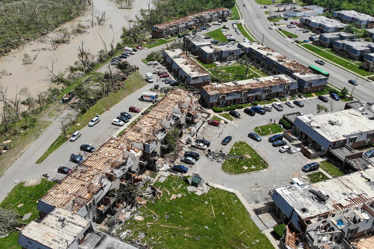 Debris is strewn about the front sidewalks of destroyed homes at the River’s Edge apartment complex, May 28, 2019, in Dayton, Ohio, the day after a tornado struck the city.