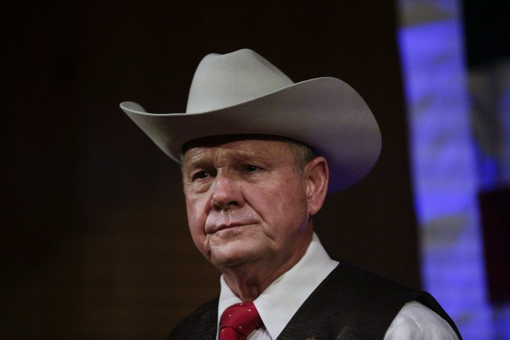 In this Sept. 25, 2017, file photo, Roy Moore speaks at a rally in Fairhope, Ala. President Donald Trump is warning that the consequences will be devastating if failed Alabama Republican Roy Moore runs again for a senate seat in 2020. 