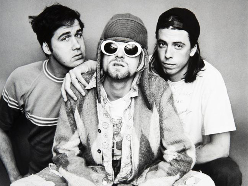 (L-R) Krist Novoselic, the late Kurt Cobain and Dave Grohl of Nirvana in 1993. The late frontman's sweater sold at auction for US$75K.