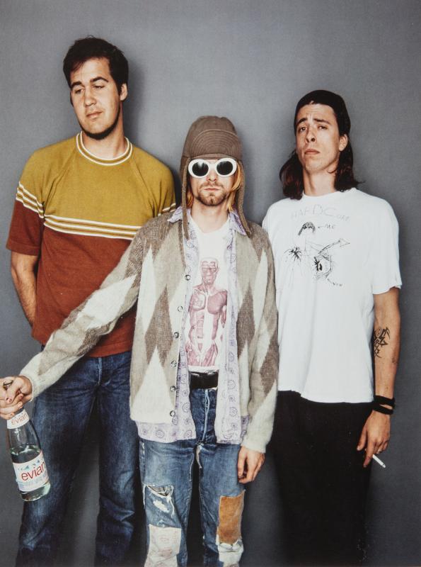 Kurt Cobain (centre) seen wearing the sweater during his final photo shoot in 1993.