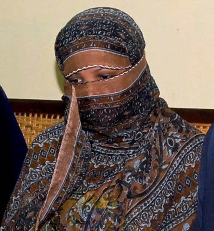 In this Nov. 20, 2010, file photo, Asia Bibi listens to officials at a prison in Sheikhupura near Lahore. (The Canadian Press/AP, File)