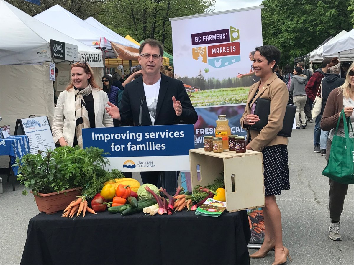 B.C. Health Minister Adrian Dix and Vancouver-Mount Pleasant MLA Melanie Mark announce the expansion of the province's farmers' market coupon program at a market in Vancouver Saturday, May 4, 2019.