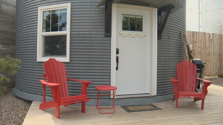 A rustic, metal grain bin has been converted into an accommodation.