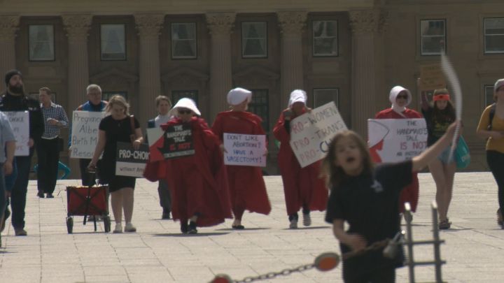 The Alberta Handmaids, a group of people who speak out against Premier Jason Kenney and his UCP government, showed up to a counter-protest during the March for Life rally at the Alberta legislature on Thursday.