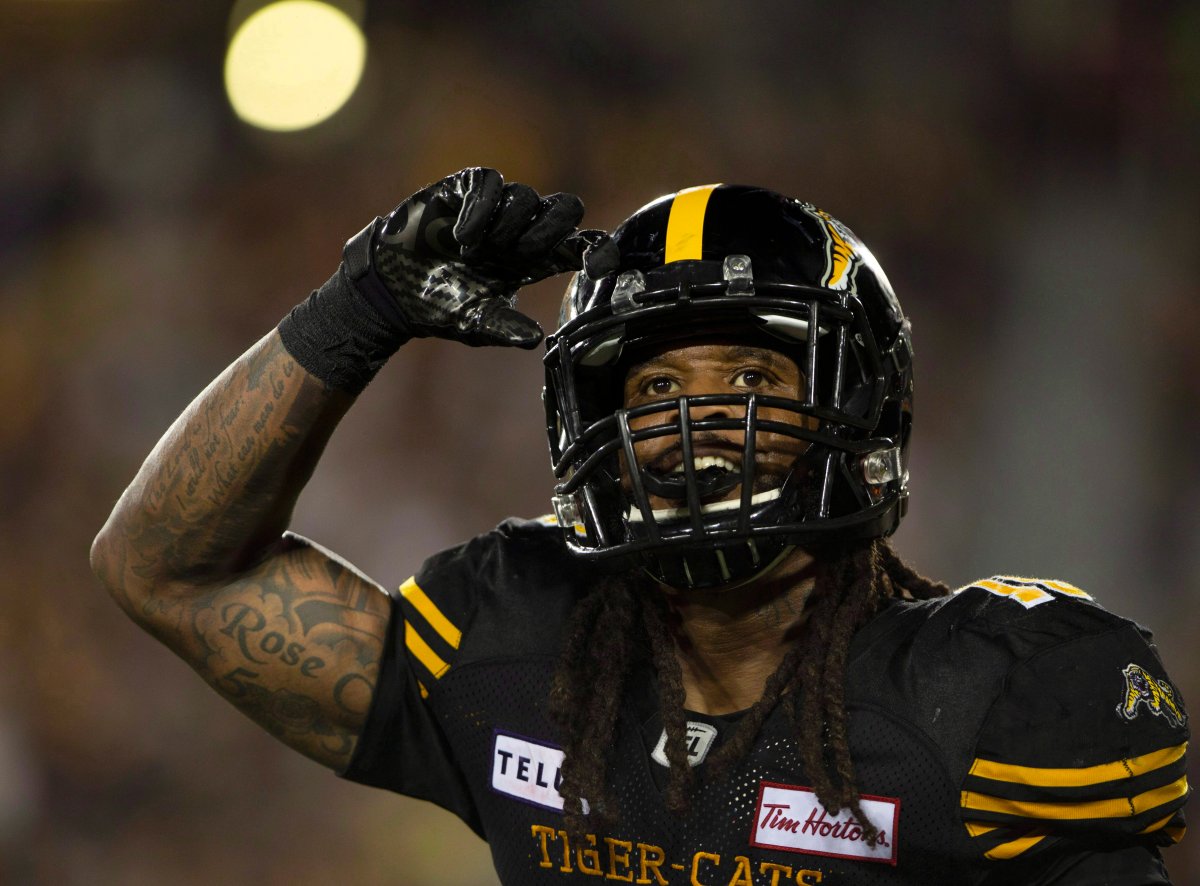 Hamilton Tiger-Cats running back Alex Green (15) salutes the fans following his touchdown during a CFL game against the Toronto Argonauts in Hamilton, on Sept. 3, 2018.