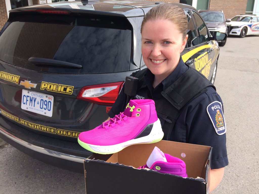Const. Anthea Fordyce holds a pair of kicks that'll be donated to a student in need on Tuesday. 