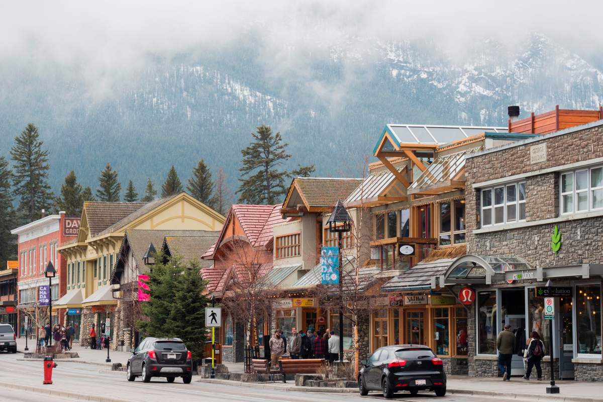 People stroll through the town of Banff inside Banff National Park in Alberta, Canada, April 21, 2017.