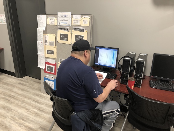 A Beyond Food Client works at a desk.