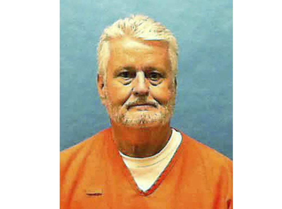 This updated photo made available by the Florida Department of Law Enforcement shows Bobby Joe Long in custody.