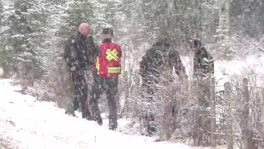 Crews seen searching in the Bragg Creek area in relation to the suspected double homicide of Jasmine Lovett and Aliyah Sanderson.